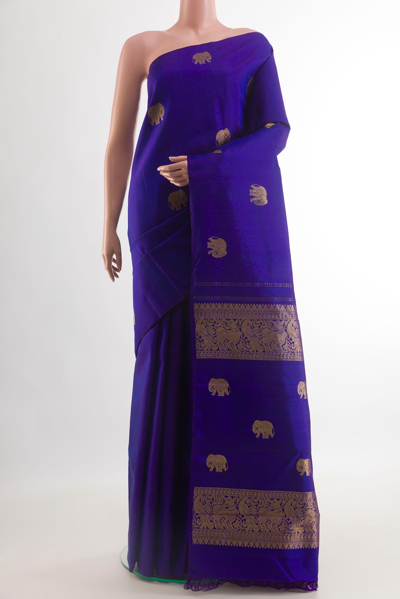 Blue Kanchipuram Silk Saree with Zari Butta on the body and Zari Border.  displayed on a mannequin