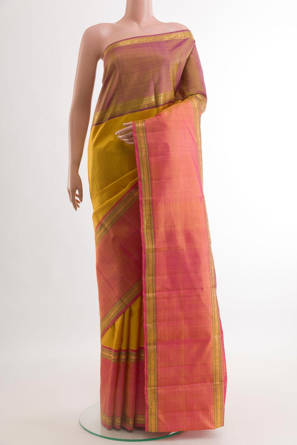 Yellow Kanjivaram Silk Saree with Checked design on the body and Zari Border.  displayed on a mannequin