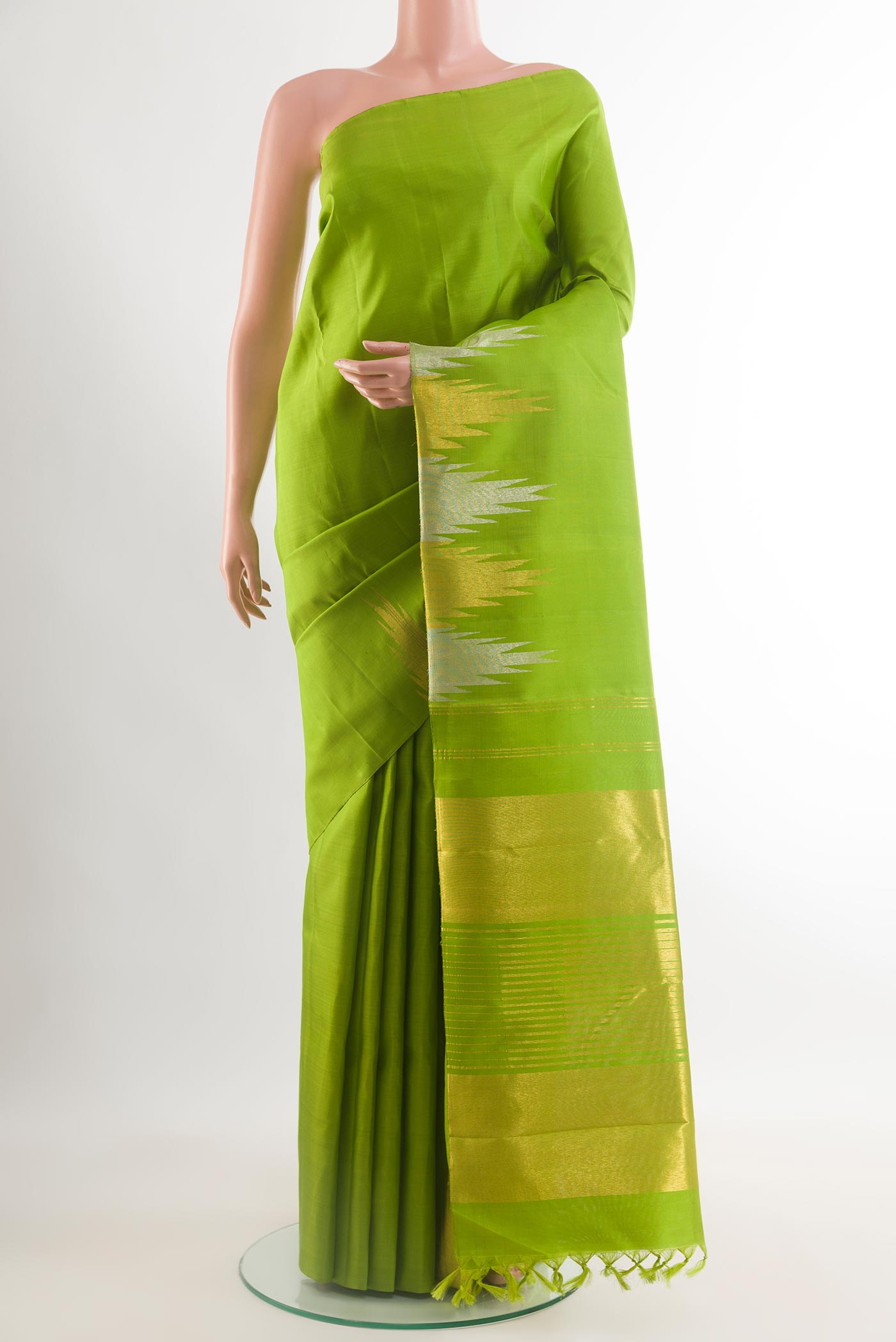 Green Kanjivaram Silk Saree with Plain Body and Temple Border.  displayed on a mannequin