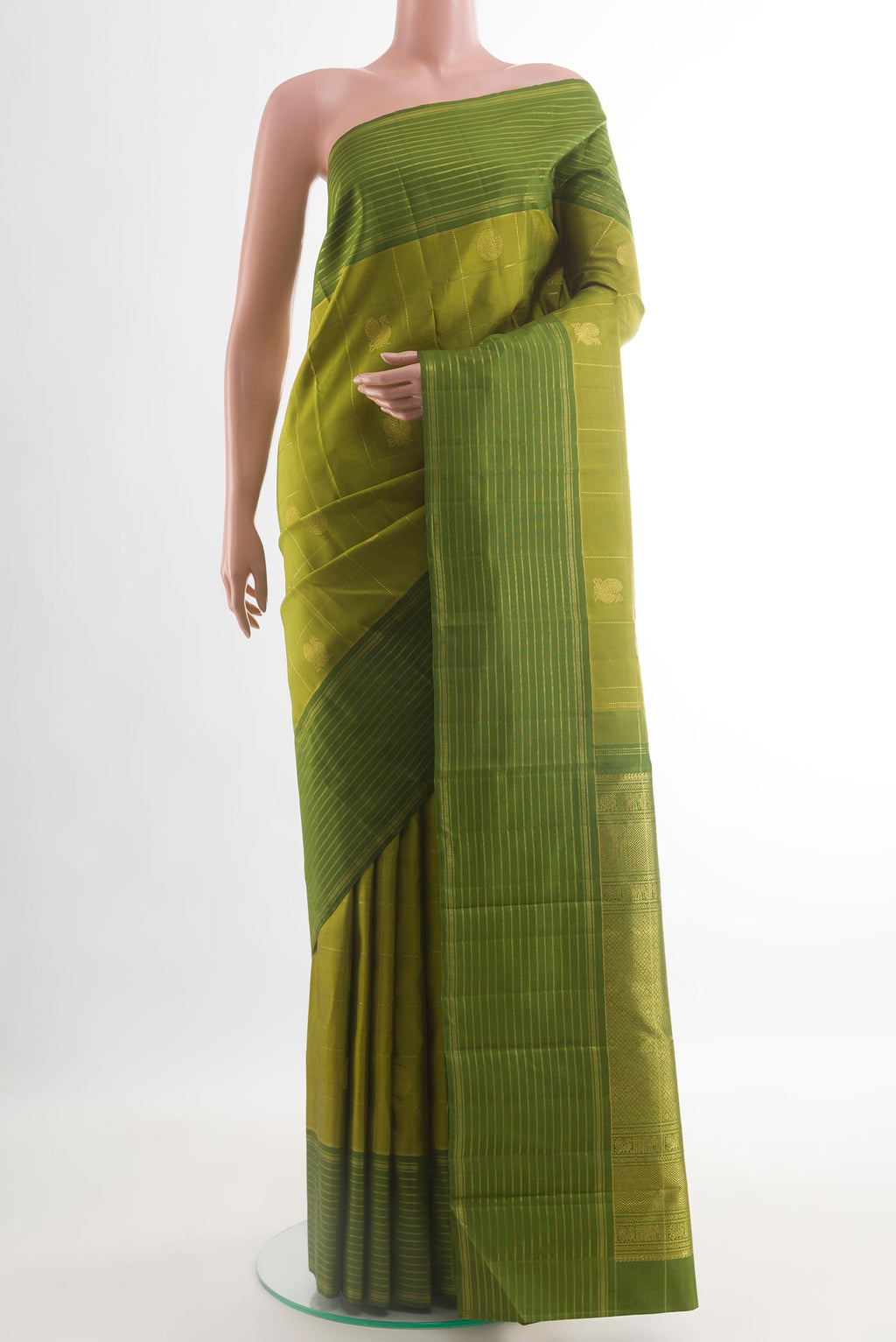 Mehandi Green Kanjivaram Silk Saree with Checked design on the body and Zari Border.  displayed on a mannequin