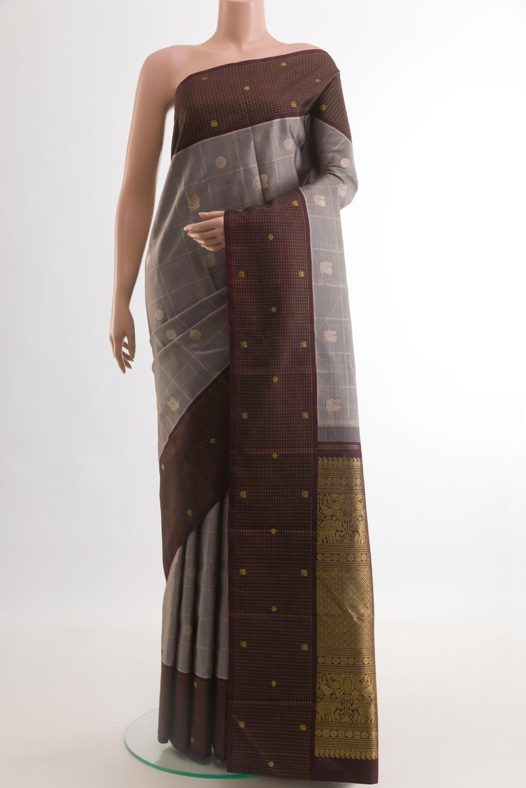 Grey Kanjivaram Silk Saree with Checked design on the body and Checks Border.  displayed on a mannequin