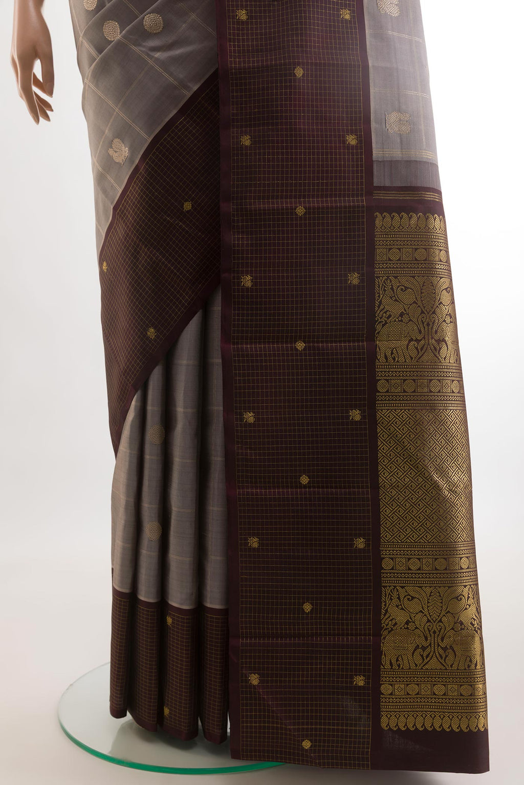 Pleats and pallu of Grey Kanjivaram Silk Saree with Checked design on the body and Checks Border. 