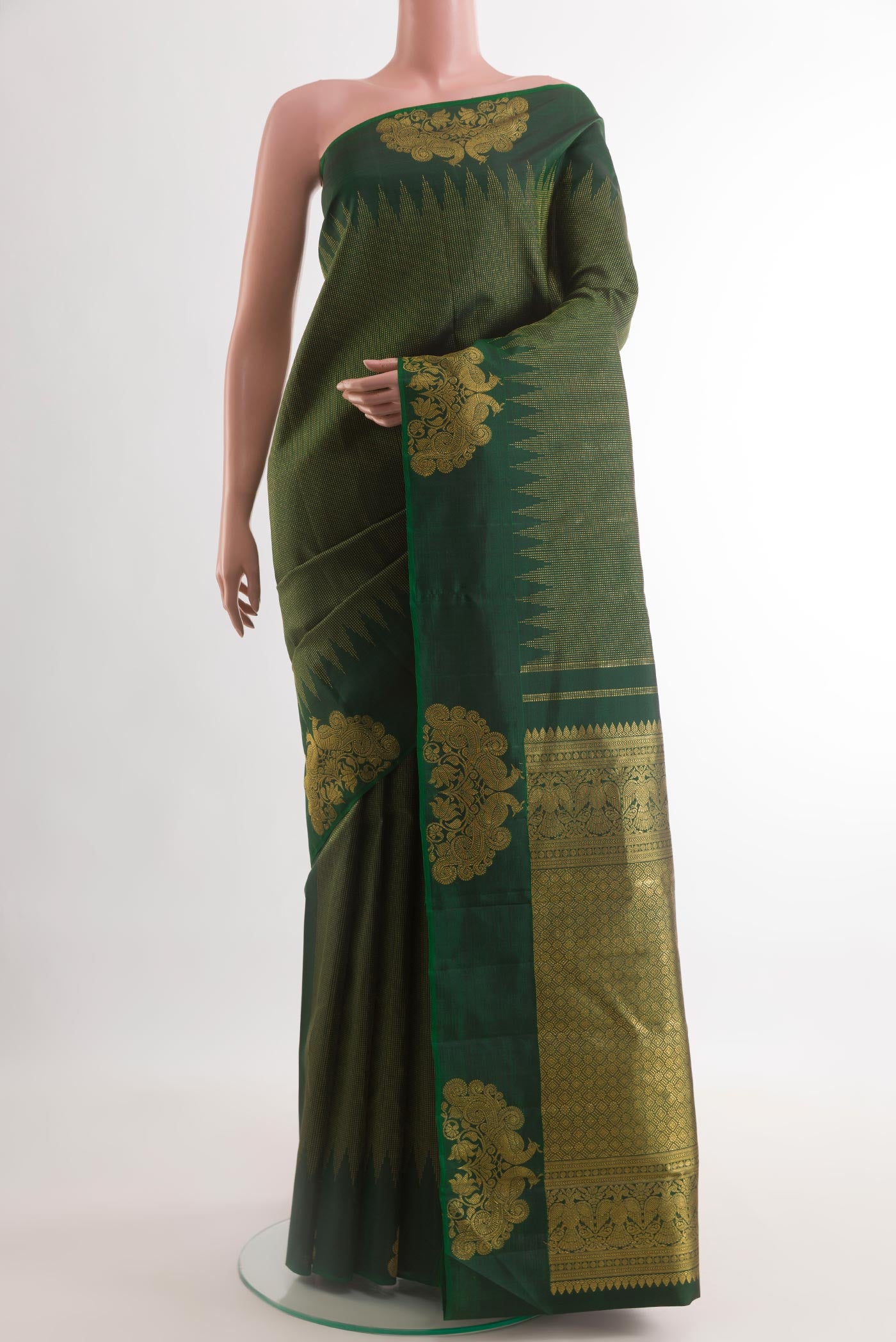 Bottle Green Kanjivaram Silk Saree with Stripes on the body and Fancy Border.  displayed on a mannequin