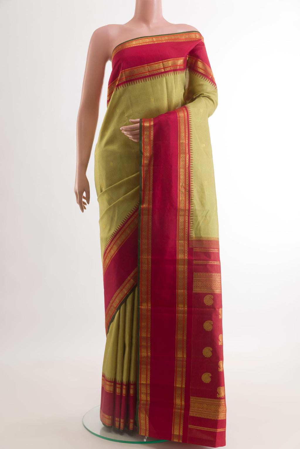 Beige Kanchipuram Silk Saree with Checked design on the body and Zari Border.  displayed on a mannequin