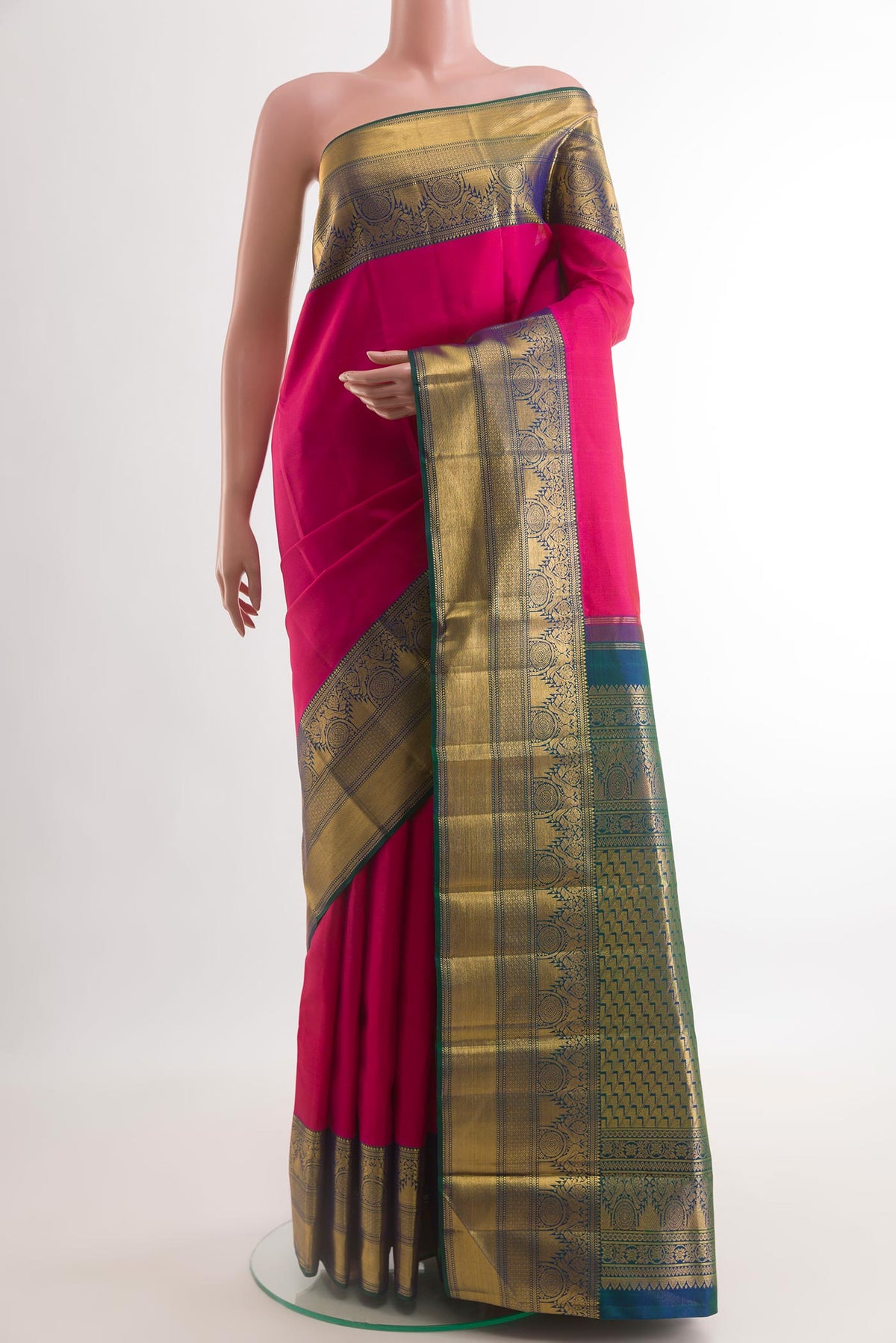 Pink Kanchipuram Silk Saree with Plain Body and Zari Border.  displayed on a mannequin