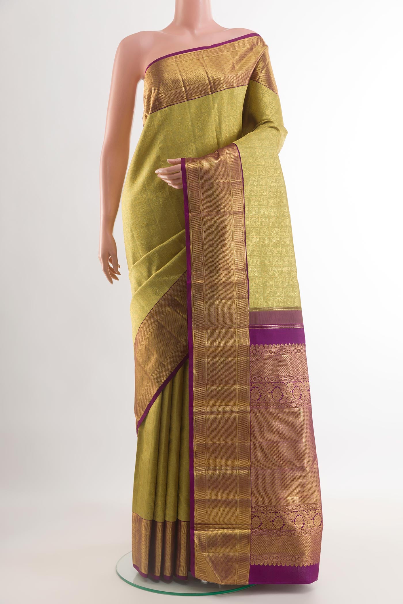 Lemon Yellow Kanchipuram Silk Saree with Zari Brocade on the body and Zari Border.  displayed on a mannequin