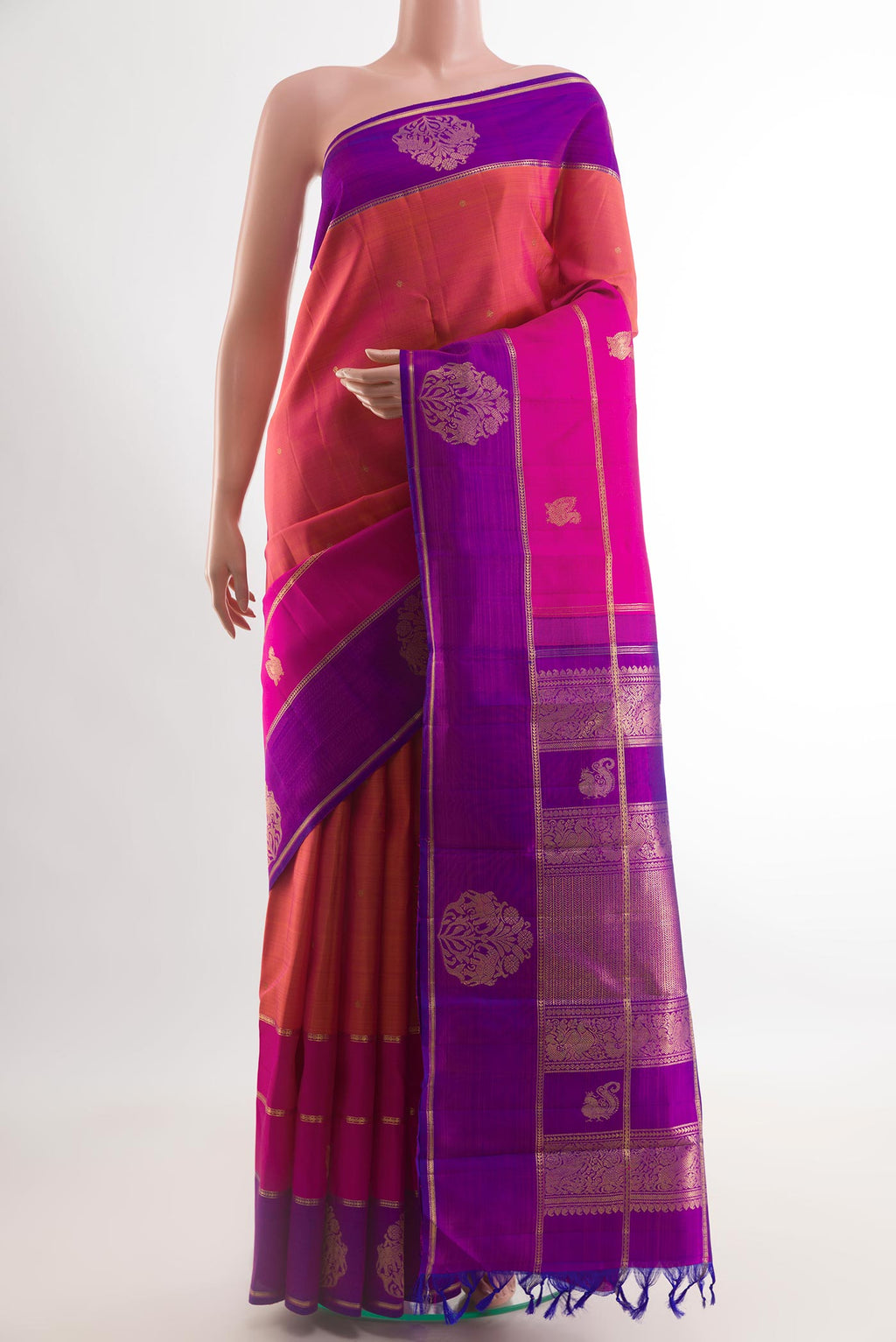 Pink with Orange Color Kanchipuram Silk Saree with Zari Butta on the body and Zari Border.  displayed on a mannequin