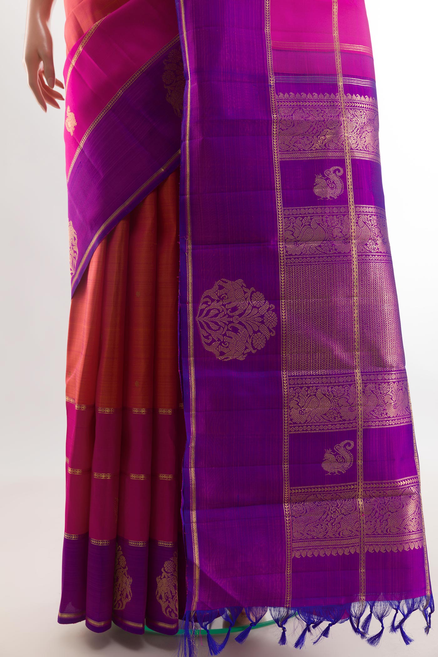 Pleats and pallu of Pink with Orange Color Kanchipuram Silk Saree with Zari Butta on the body and Zari Border. 