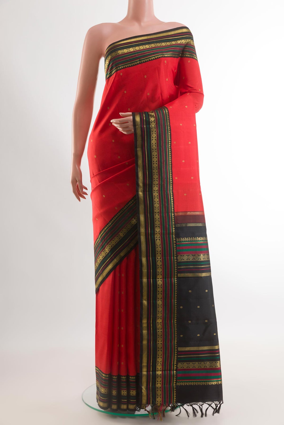 Red Kanchipuram Silk Saree with Zari Butta on the body and Zari Border.  displayed on a mannequin