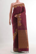 Maroon Kanchipuram Silk Saree with Zari Butta on the body and Zari Border.  displayed on a mannequin