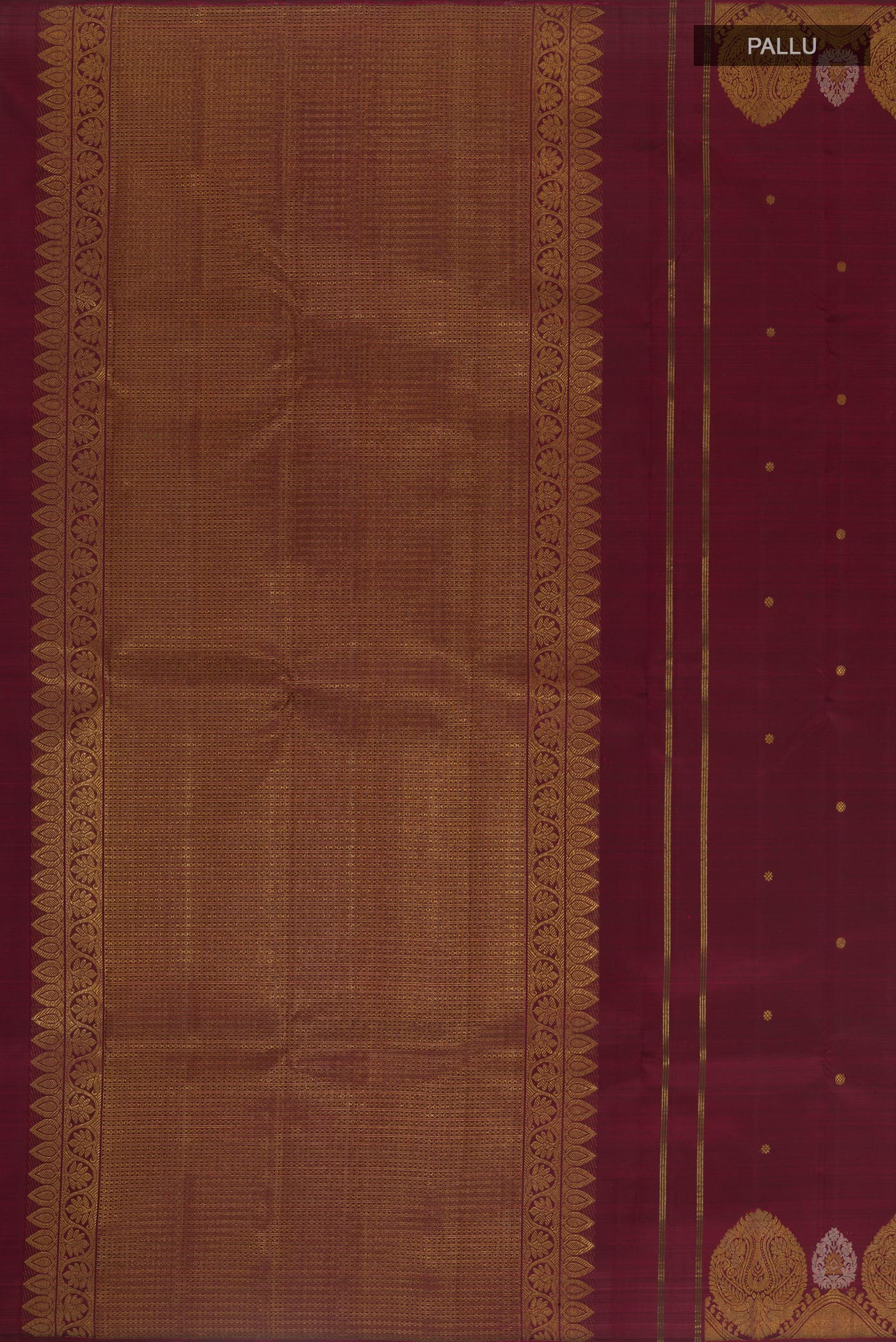 Close up image of the pallu of Maroon Kanchipuram Silk Saree with Zari Butta on the body and Zari Border. 