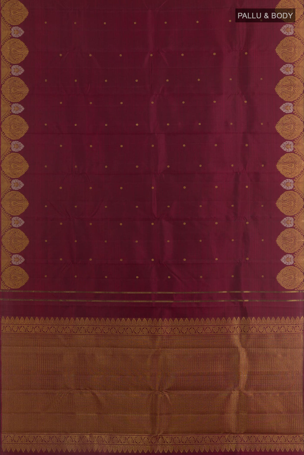 Flat view of Maroon Kanchipuram Silk Saree with Zari Butta on the body and Zari Border. 