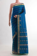 Peacock Blue Kanchipuram Silk Saree with Stripes on the body and Zari Border.  displayed on a mannequin