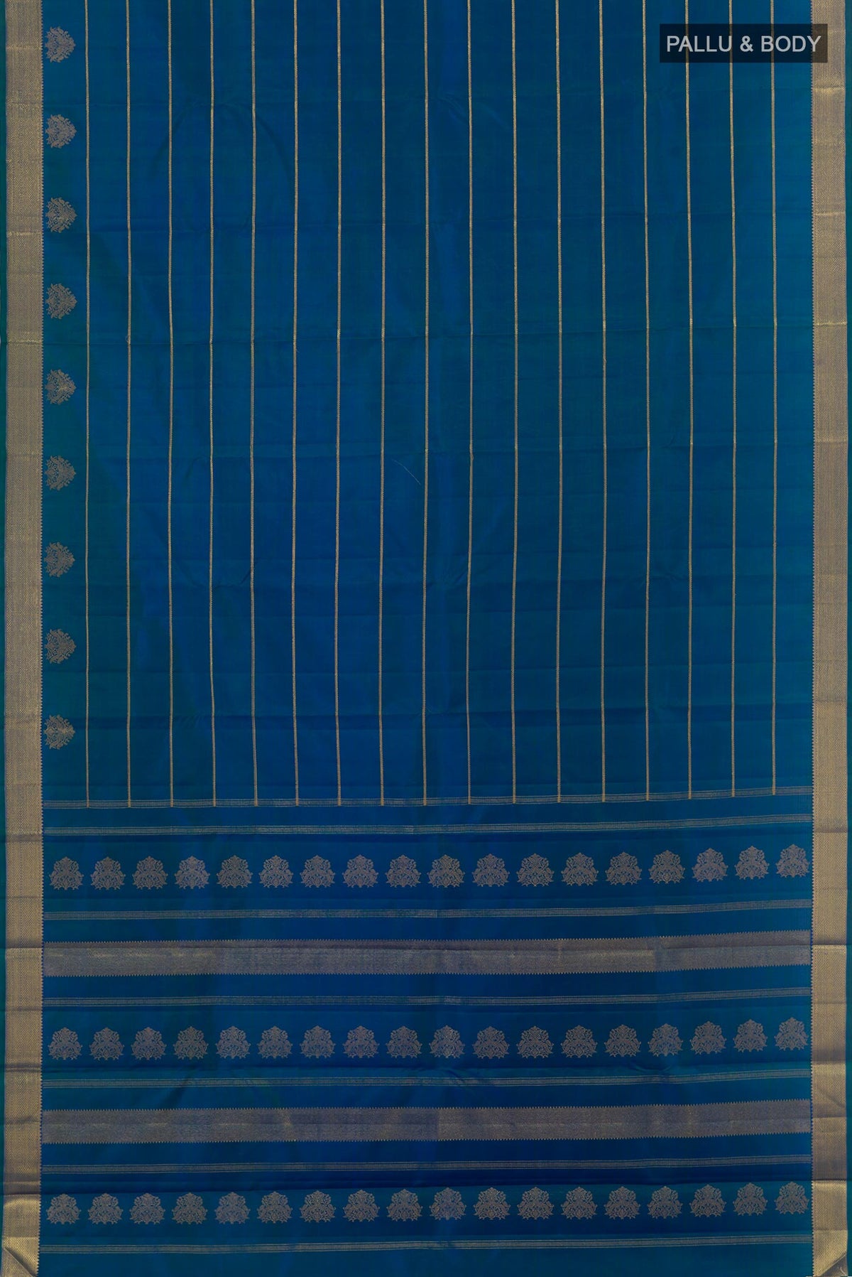 Flat view of Peacock Blue Kanchipuram Silk Saree with Stripes on the body and Zari Border. 