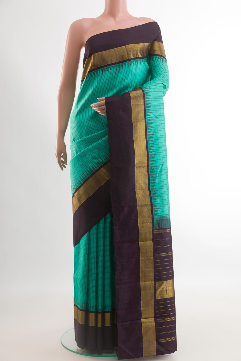 Sea Green Kanjivaram Silk Saree with Checked design on the body and Zari Border.  displayed on a mannequin