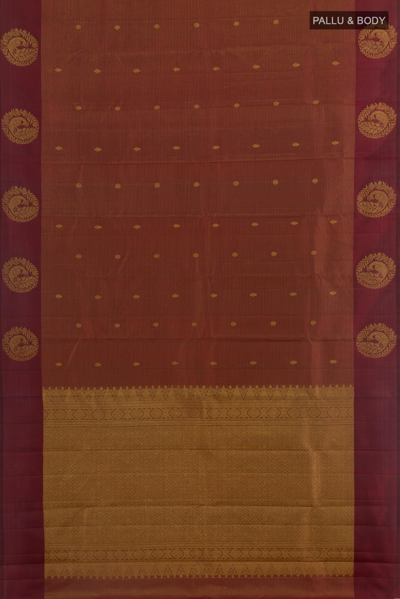 Flat view of Maroon Kanchipuram Silk Saree with Zari Butta on the body and Zari Border. 