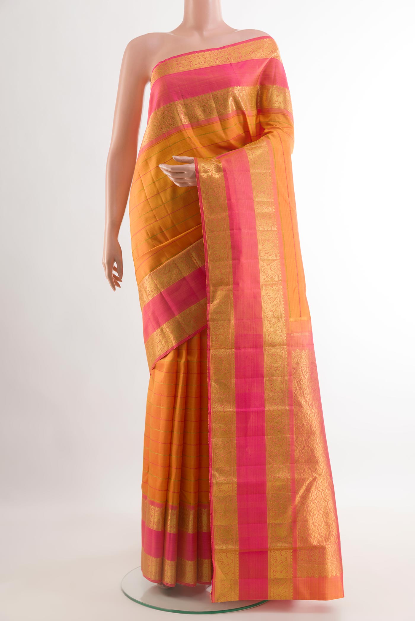Yellow Kanjivaram Silk Saree with Stripes on the body and Zari Border.  displayed on a mannequin