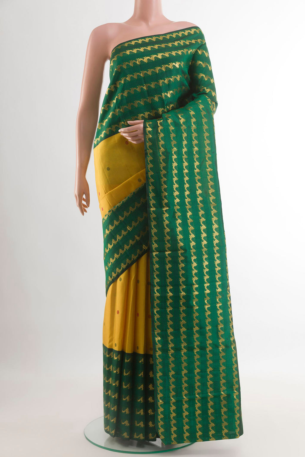 Yellow Kanjivaram Silk Saree with Thread Butta on the body and Fancy Border.  displayed on a mannequin