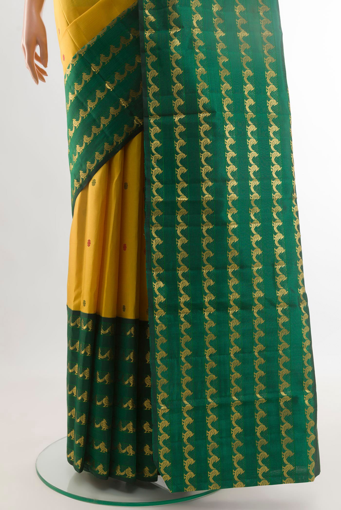 Pleats and pallu of Yellow Kanjivaram Silk Saree with Thread Butta on the body and Fancy Border. 