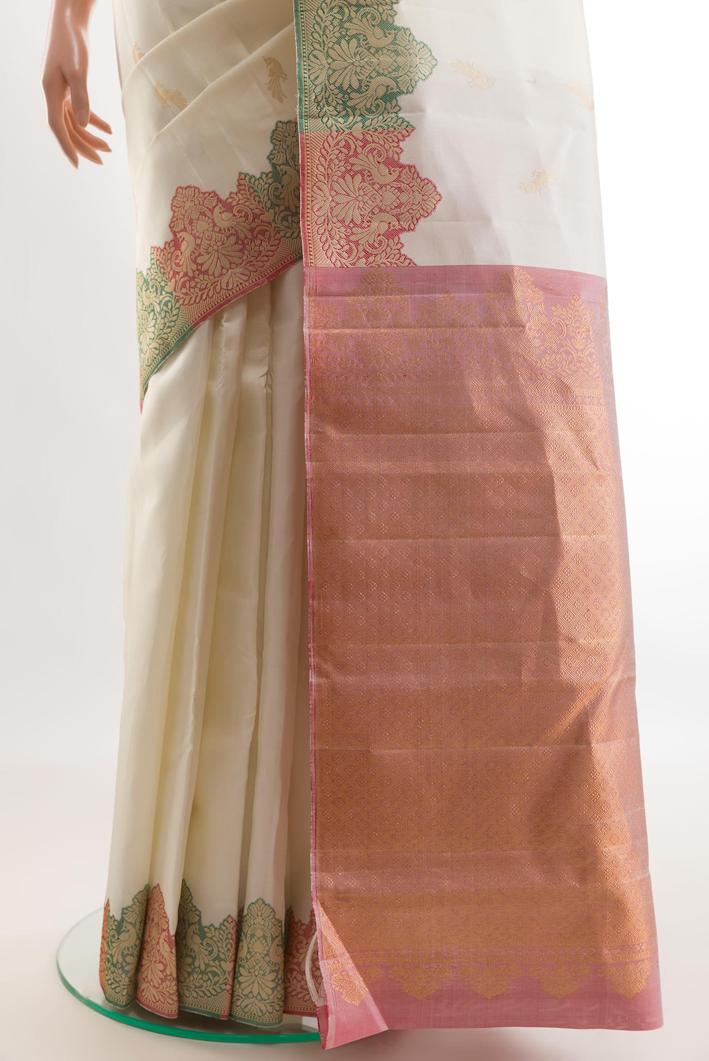 Pleats and pallu of Off White Kanchipuram Silk Saree with Zari Butta on the body and Fancy Border. 