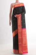 Black Kanjivaram Silk Saree with Zari Butta on the body and Zari Border.  displayed on a mannequin