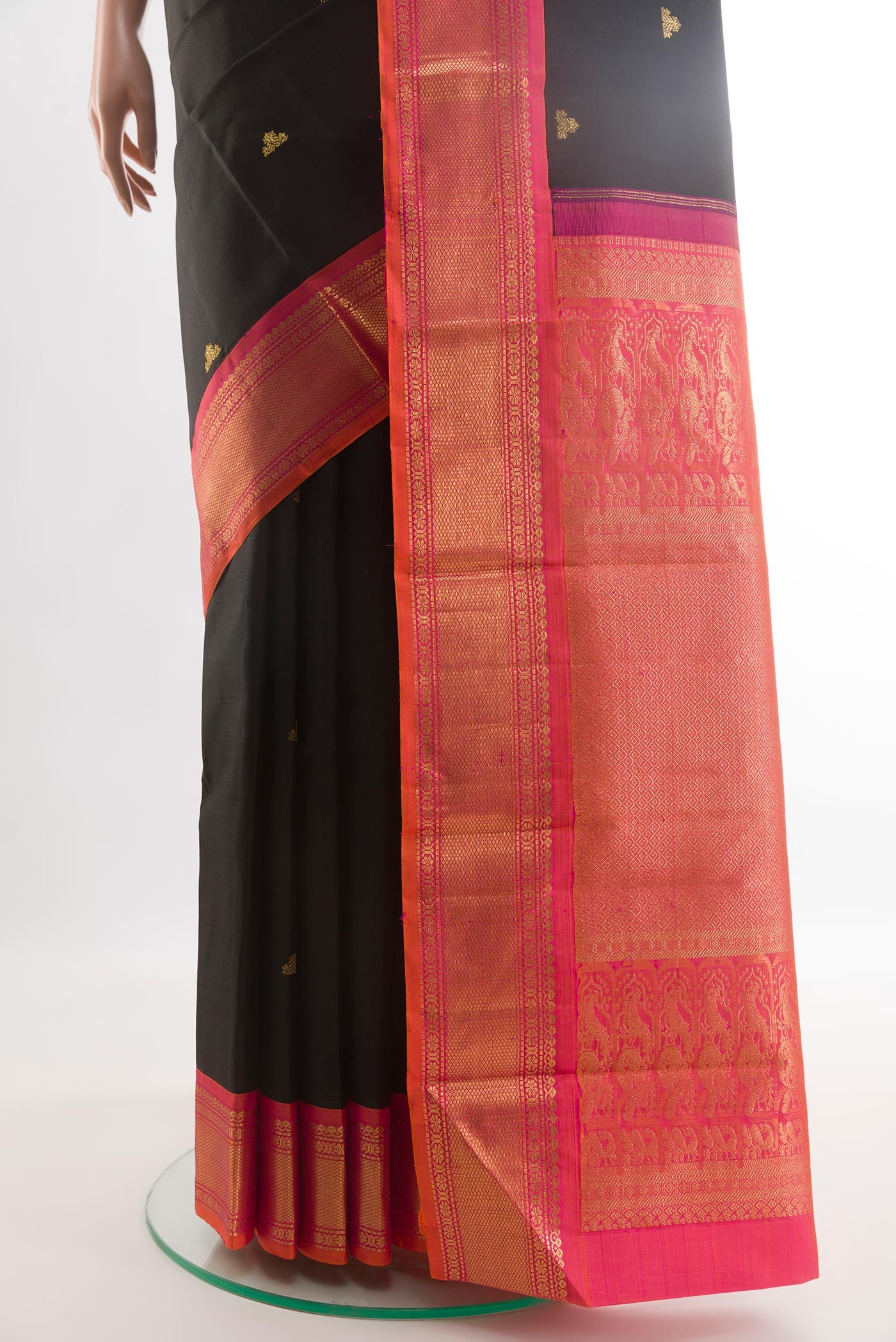 Pleats and pallu of Black Kanjivaram Silk Saree with Zari Butta on the body and Zari Border. 