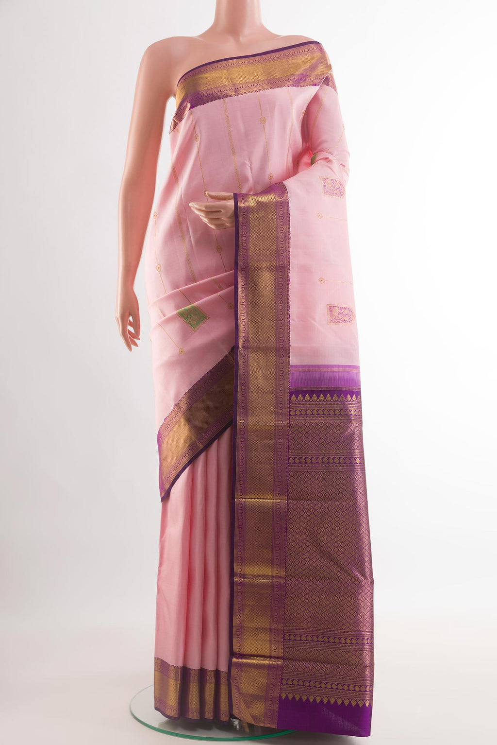 Rose pink Kanchipuram Silk Saree with Zari Butta on the body and Zari Border.  displayed on a mannequin