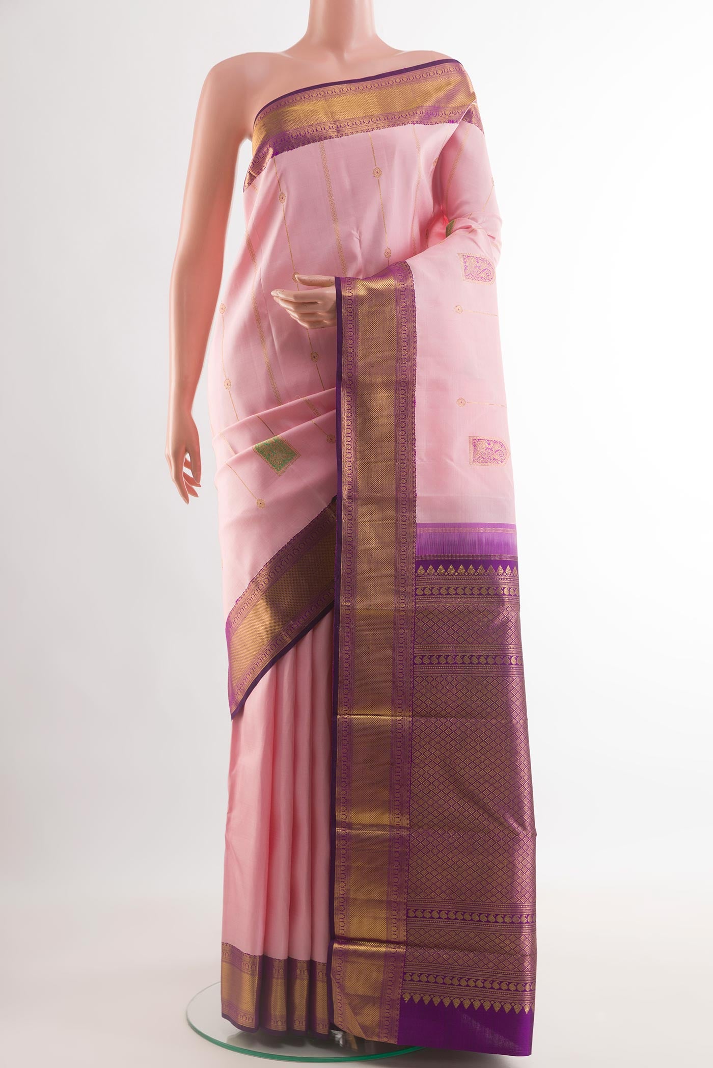 Rose pink Kanchipuram Silk Saree with Zari Butta on the body and Zari Border.  displayed on a mannequin