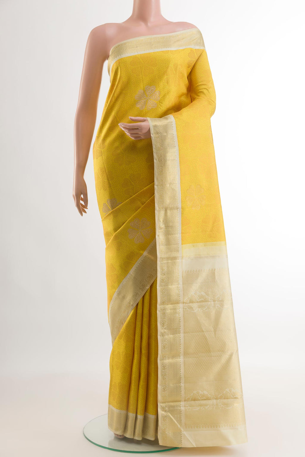 Yellow Kanchipuram Silk Saree with Jacquard With Zari Butta on the body and Zari Border.  displayed on a mannequin