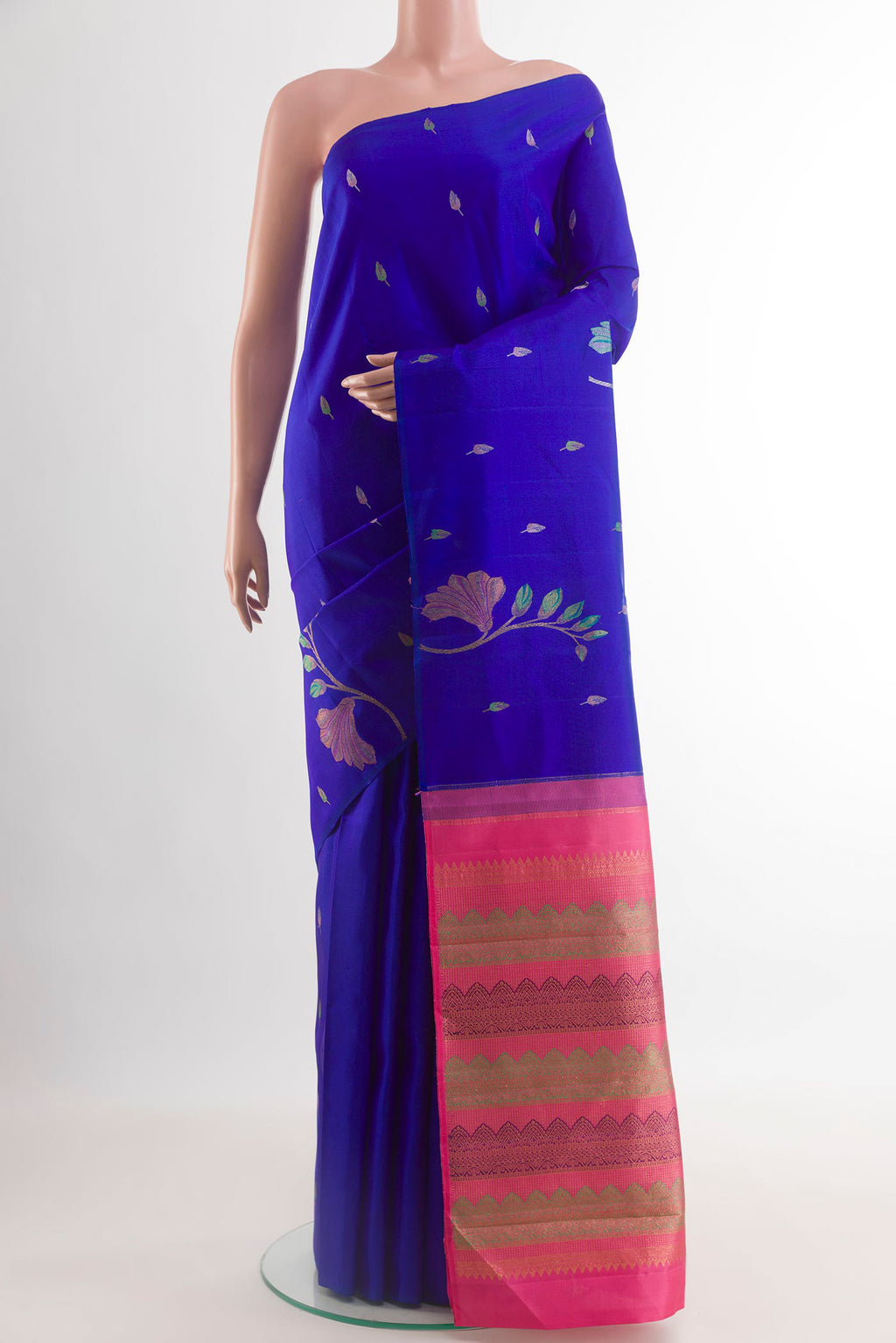 Royal Blue Kanjivaram Silk Saree with Zari Butta on the body and Without Border.  displayed on a mannequin