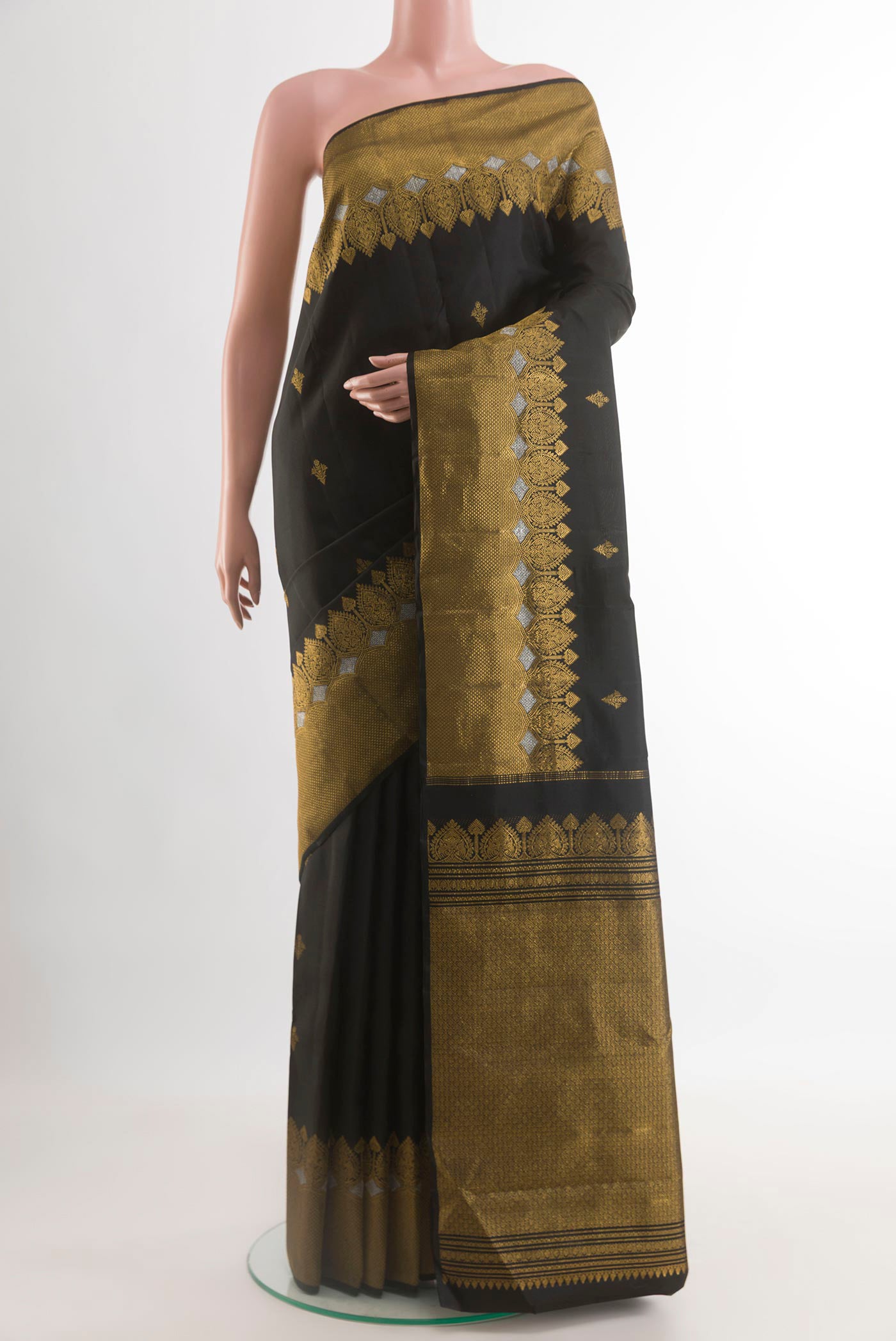 Black Kanjivaram Silk Saree with Zari Butta on the body and Zari Border.  displayed on a mannequin