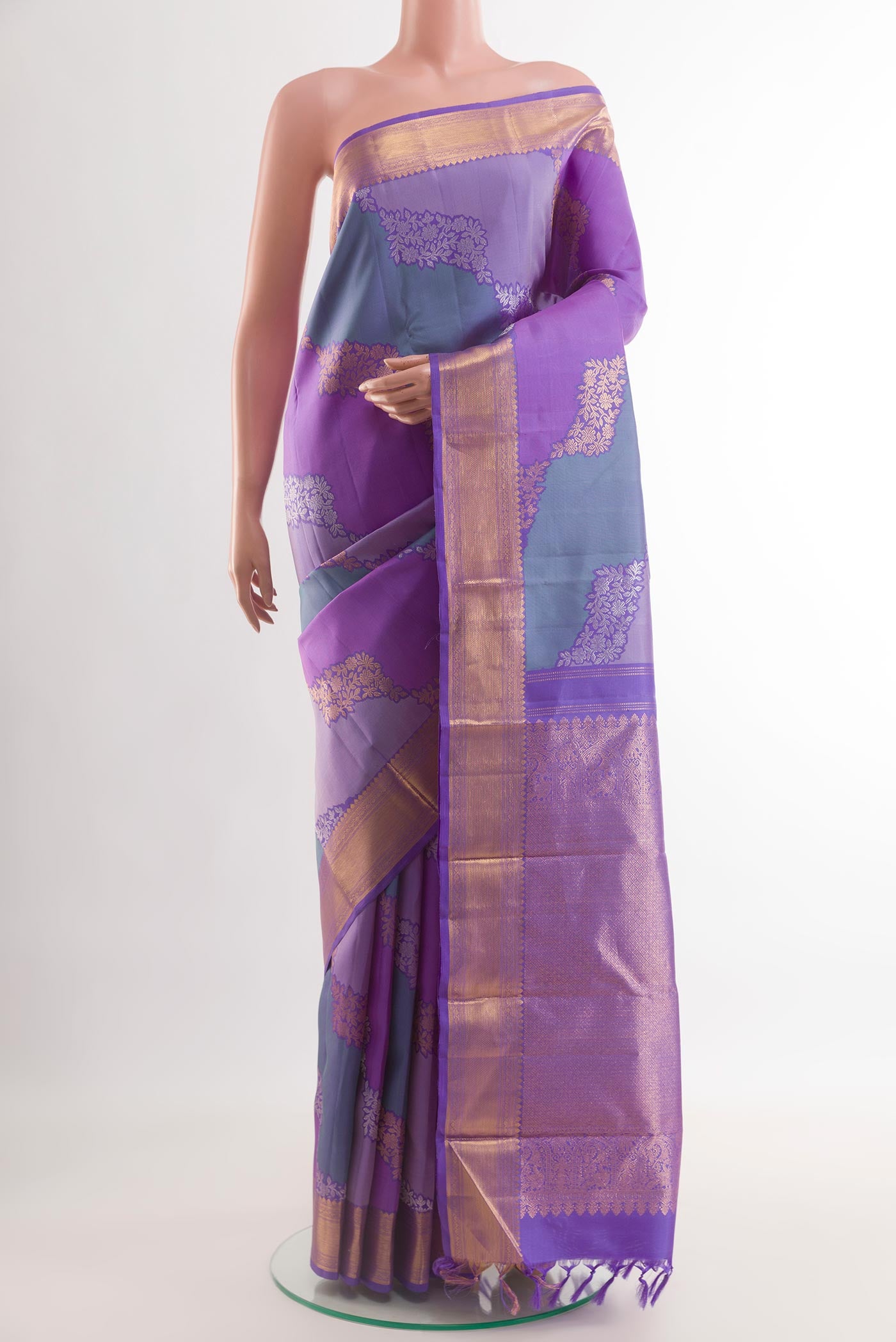 Lavender Kanchipuram Silk Saree with Zari Brocade on the body and Zari Border.  displayed on a mannequin