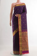 Purple Kanchipuram Silk Saree with Zari Butta on the body and Zari Border.  displayed on a mannequin