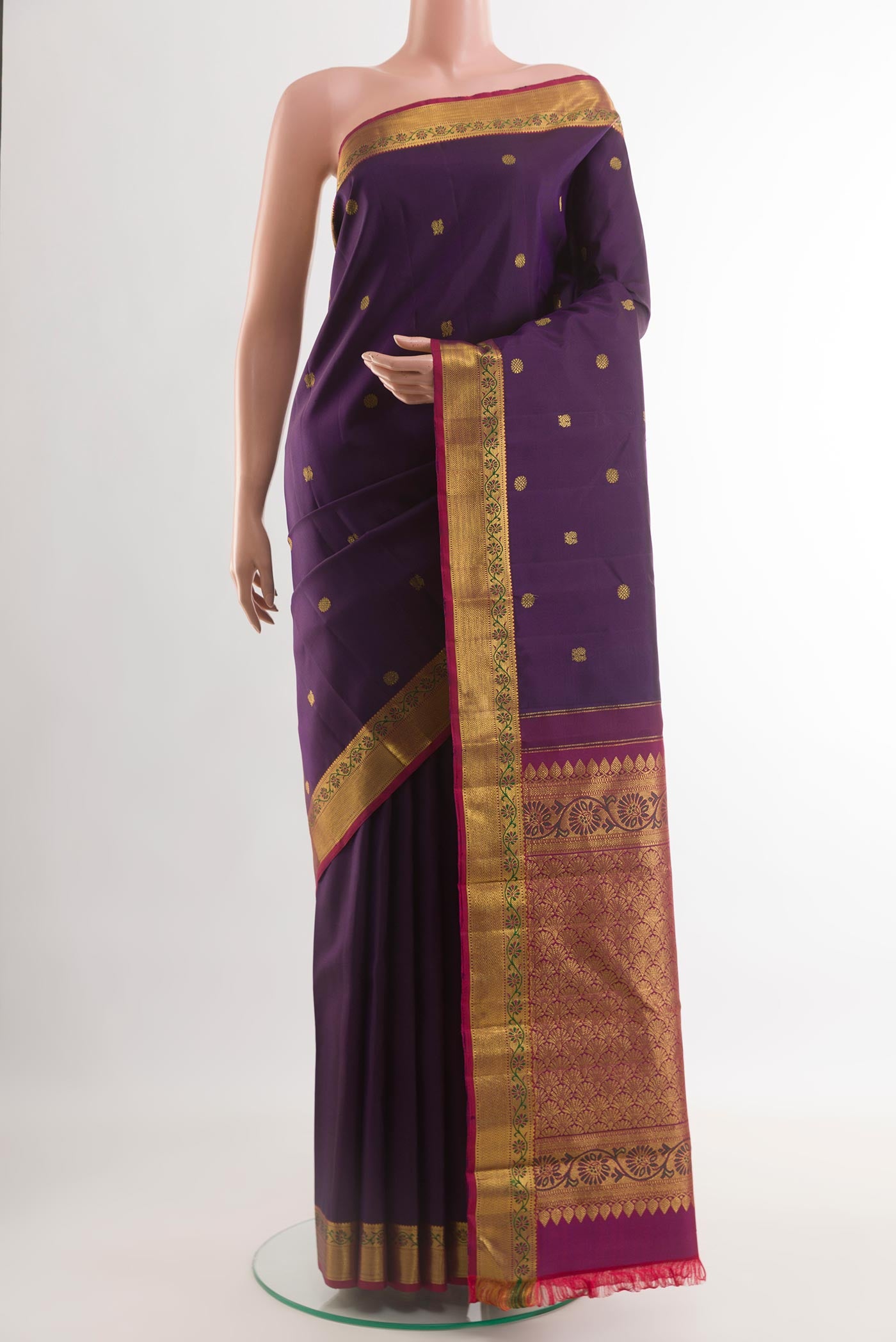 Purple Kanchipuram Silk Saree with Zari Butta on the body and Zari Border.  displayed on a mannequin