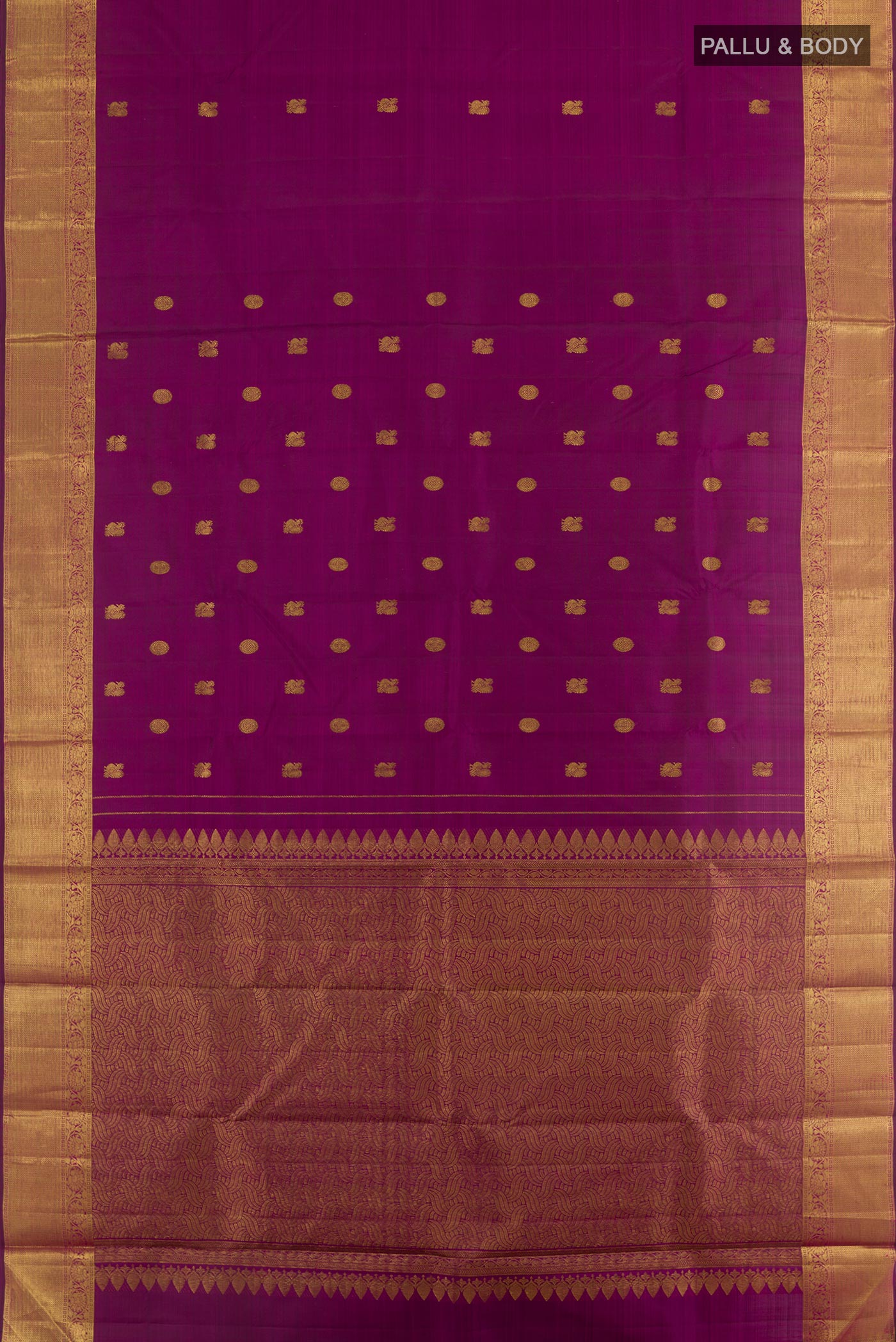 Flat view of Purple Kanjivaram Silk Saree with Zari Butta on the body and Zari Border. 