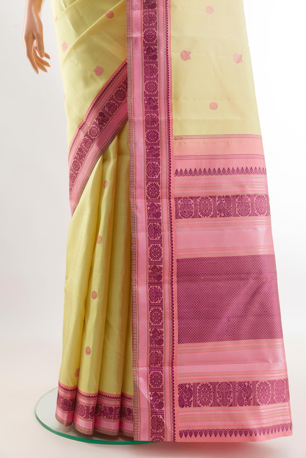 Pleats and pallu of Lemon Yellow Kanjivaram Silk Saree with Thread Butta on the body and Thread Border. 