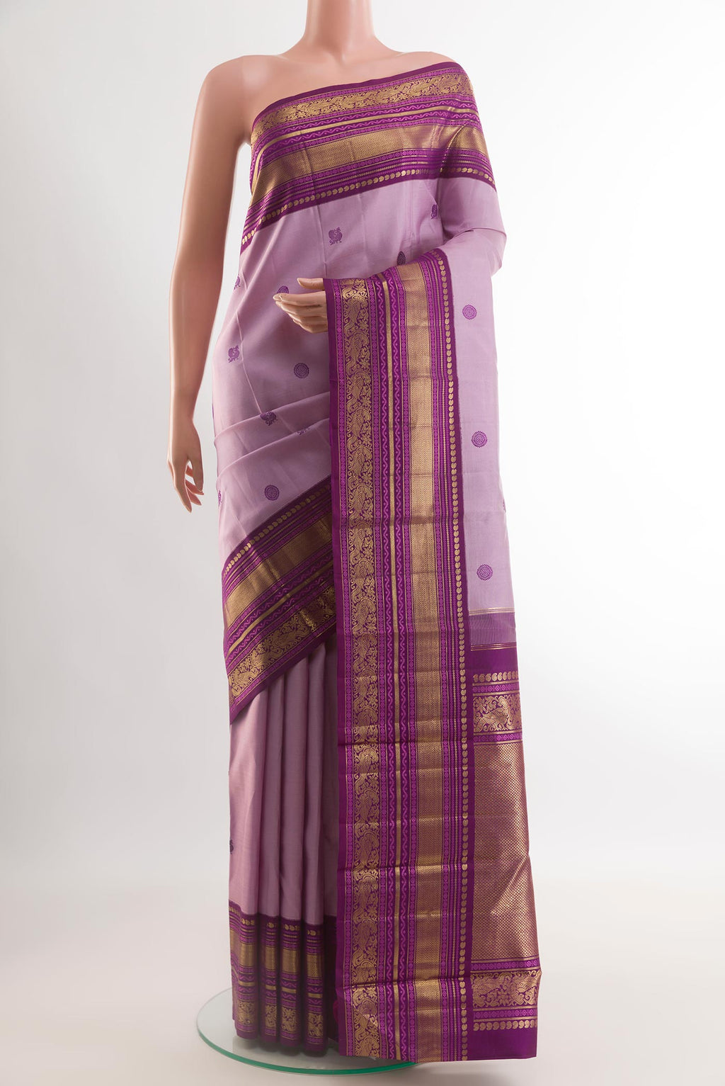Lavender Kanchipuram Silk Saree with Thread Butta on the body and Zari Border.  displayed on a mannequin