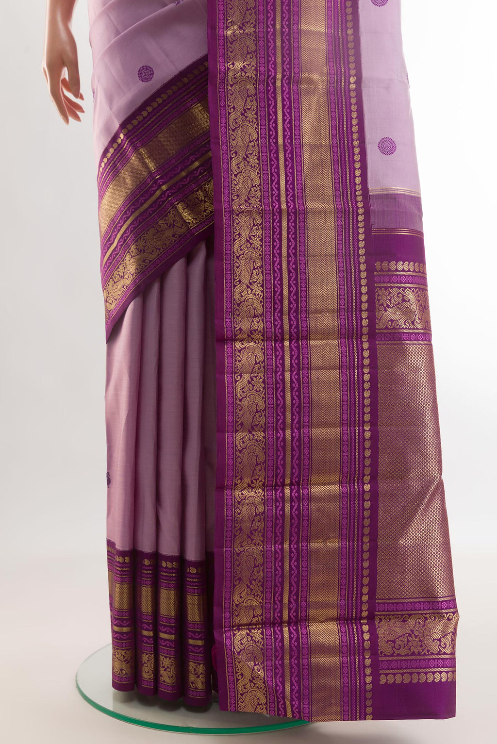 Pleats and pallu of Lavender Kanchipuram Silk Saree with Thread Butta on the body and Zari Border. 
