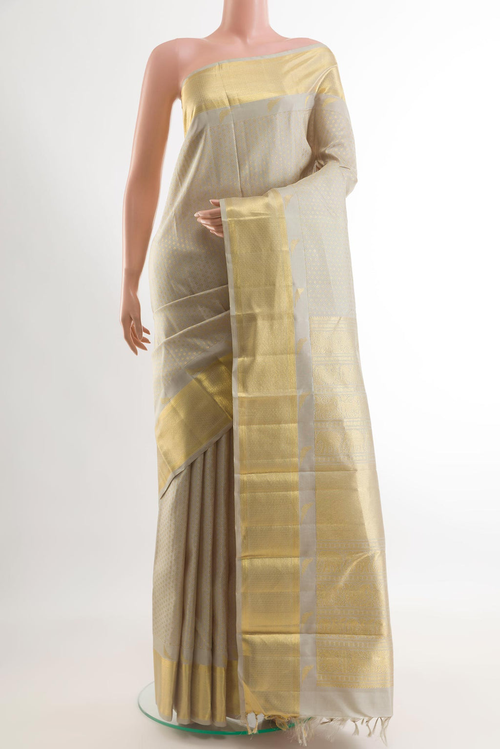 Grey Kanchipuram Silk Saree with Zari Butta on the body and Zari Border.  displayed on a mannequin