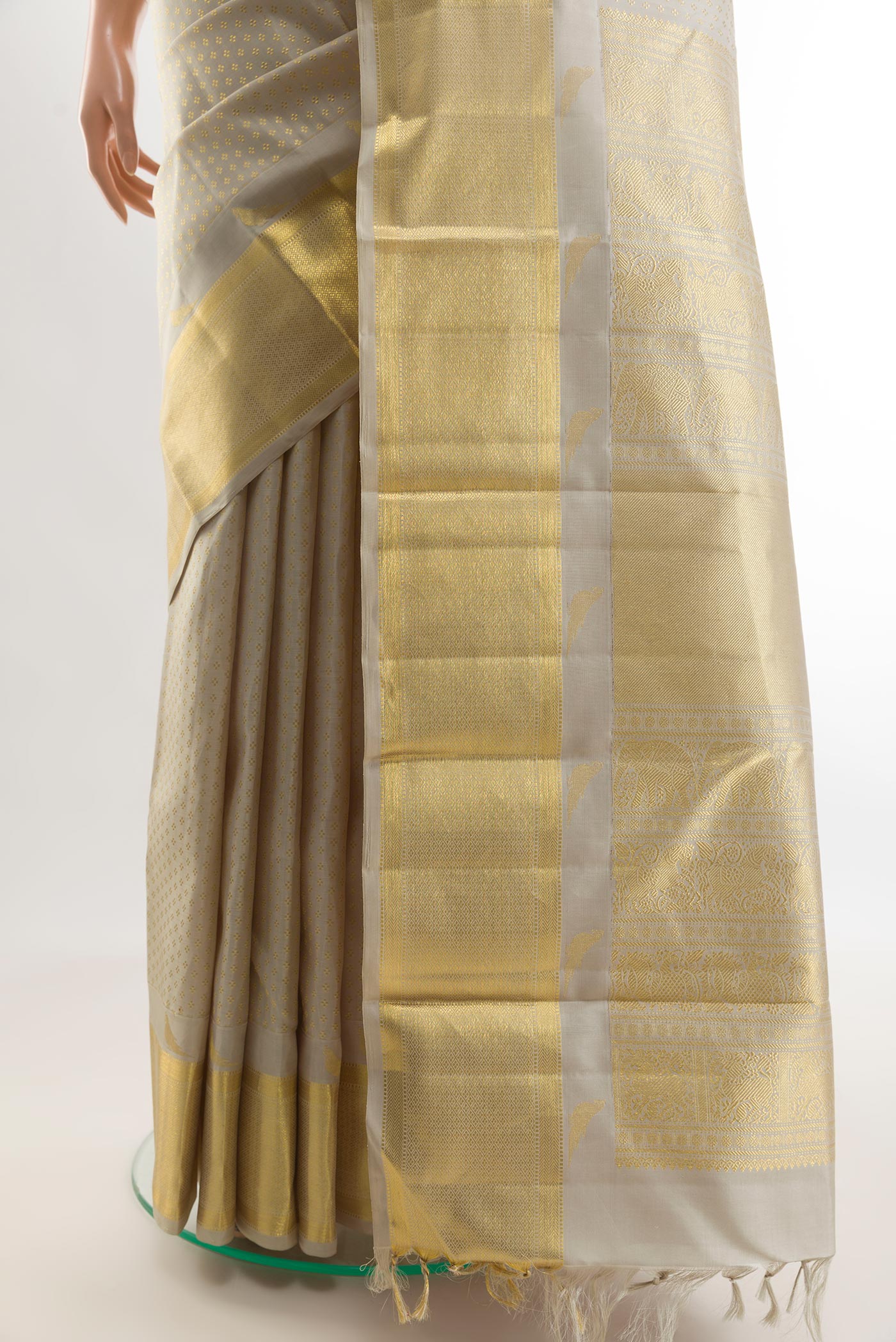 Pleats and pallu of Grey Kanchipuram Silk Saree with Zari Butta on the body and Zari Border. 