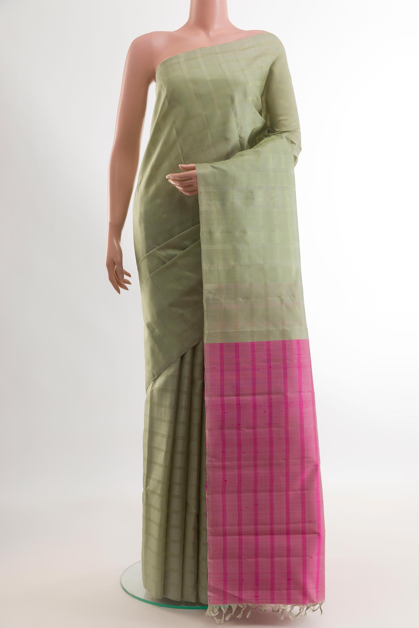 Sage Green Kanchipuram Silk Saree with Stripes on the body and Without Border.  displayed on a mannequin
