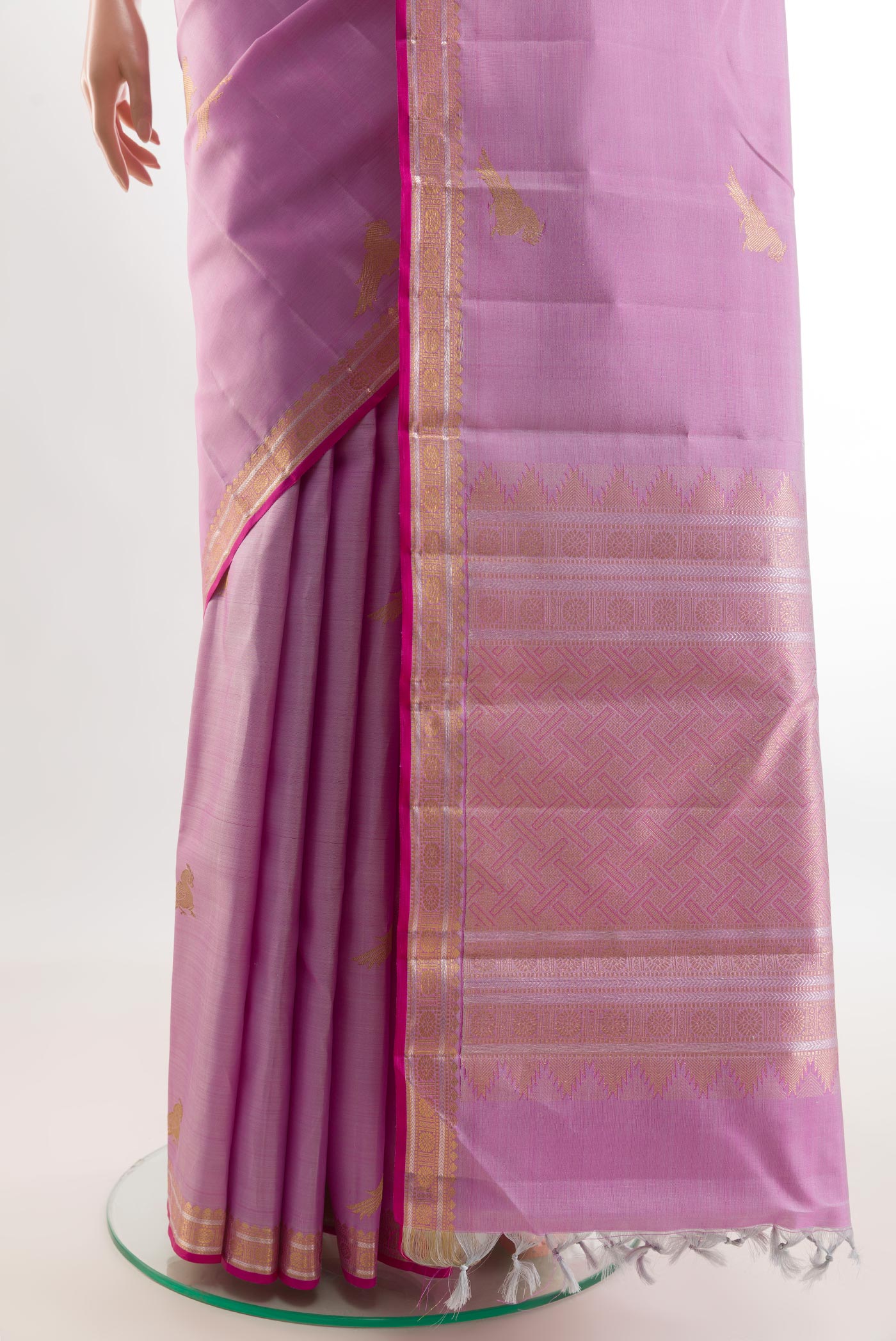 Pleats and pallu of Lavender Kanjivaram Silk Saree with Zari Butta on the body and Zari Border. 
