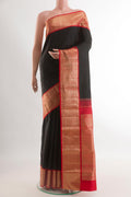 Black Kanjivaram Silk Saree with Plain Body and Zari Border.  displayed on a mannequin