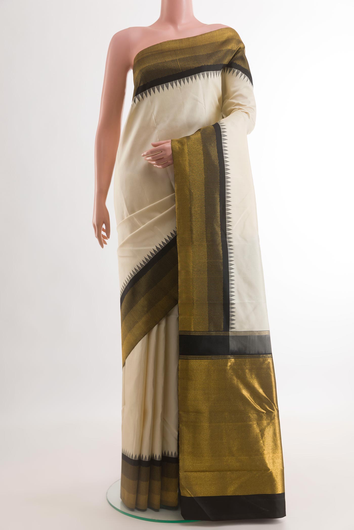 Off White Kanchipuram Silk Saree with Checked design on the body and Zari Border.  displayed on a mannequin