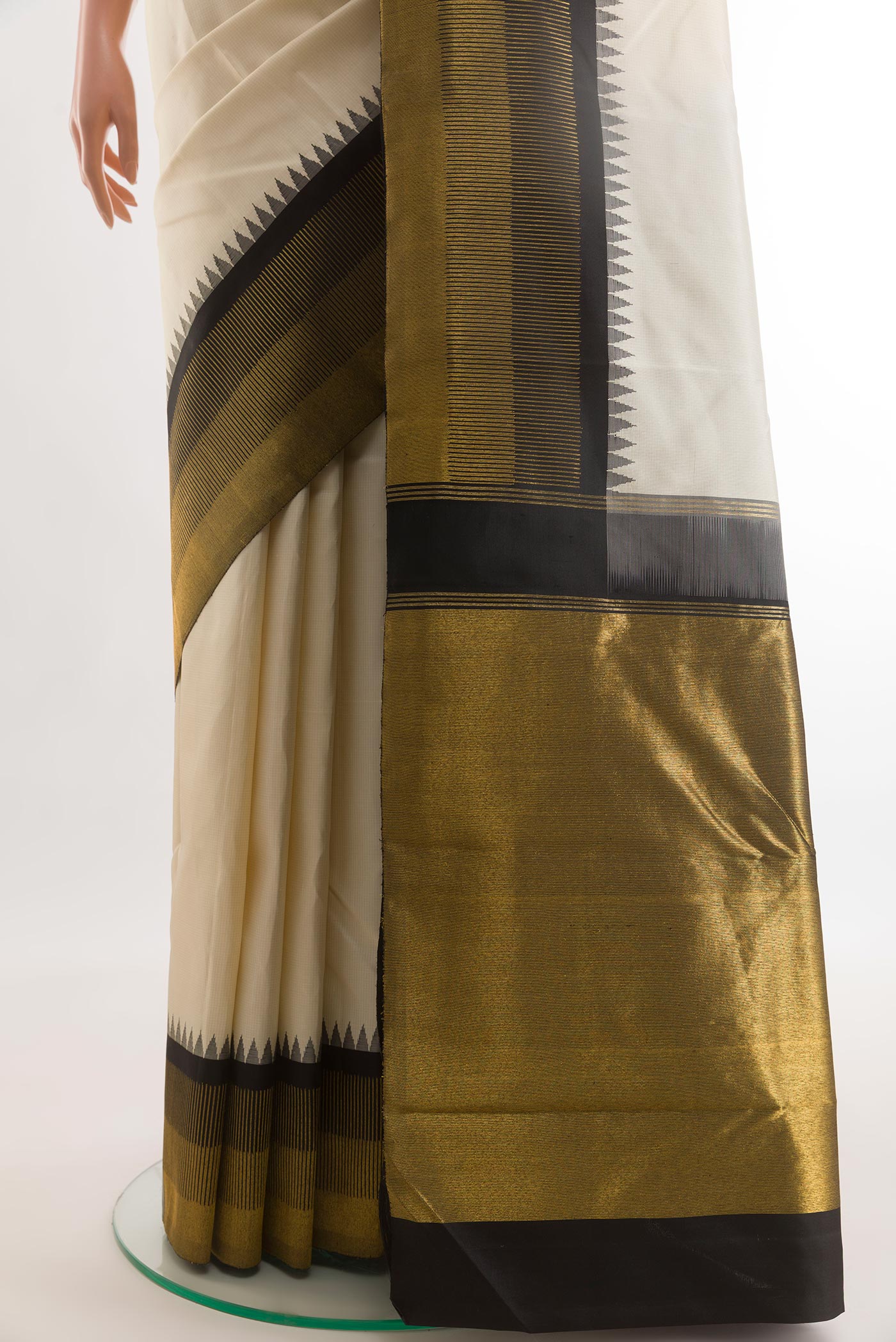 Pleats and pallu of Off White Kanchipuram Silk Saree with Checked design on the body and Zari Border. 