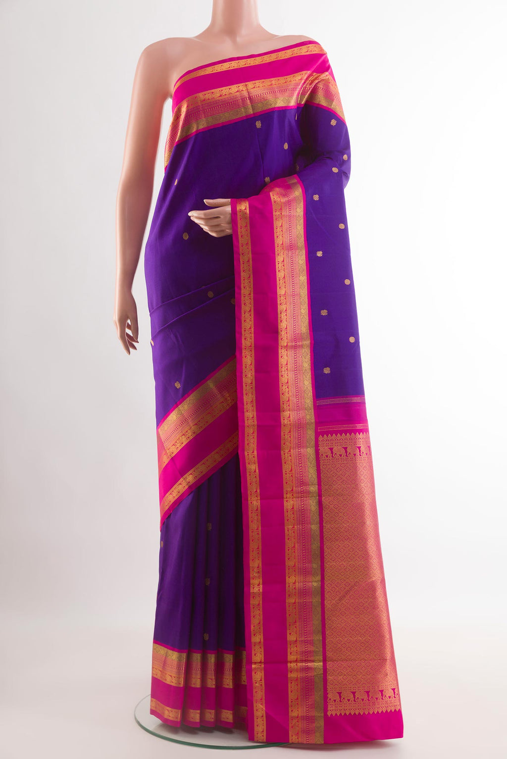 Blue Kanchipuram Silk Saree with Zari Butta on the body and Zari Border.  displayed on a mannequin