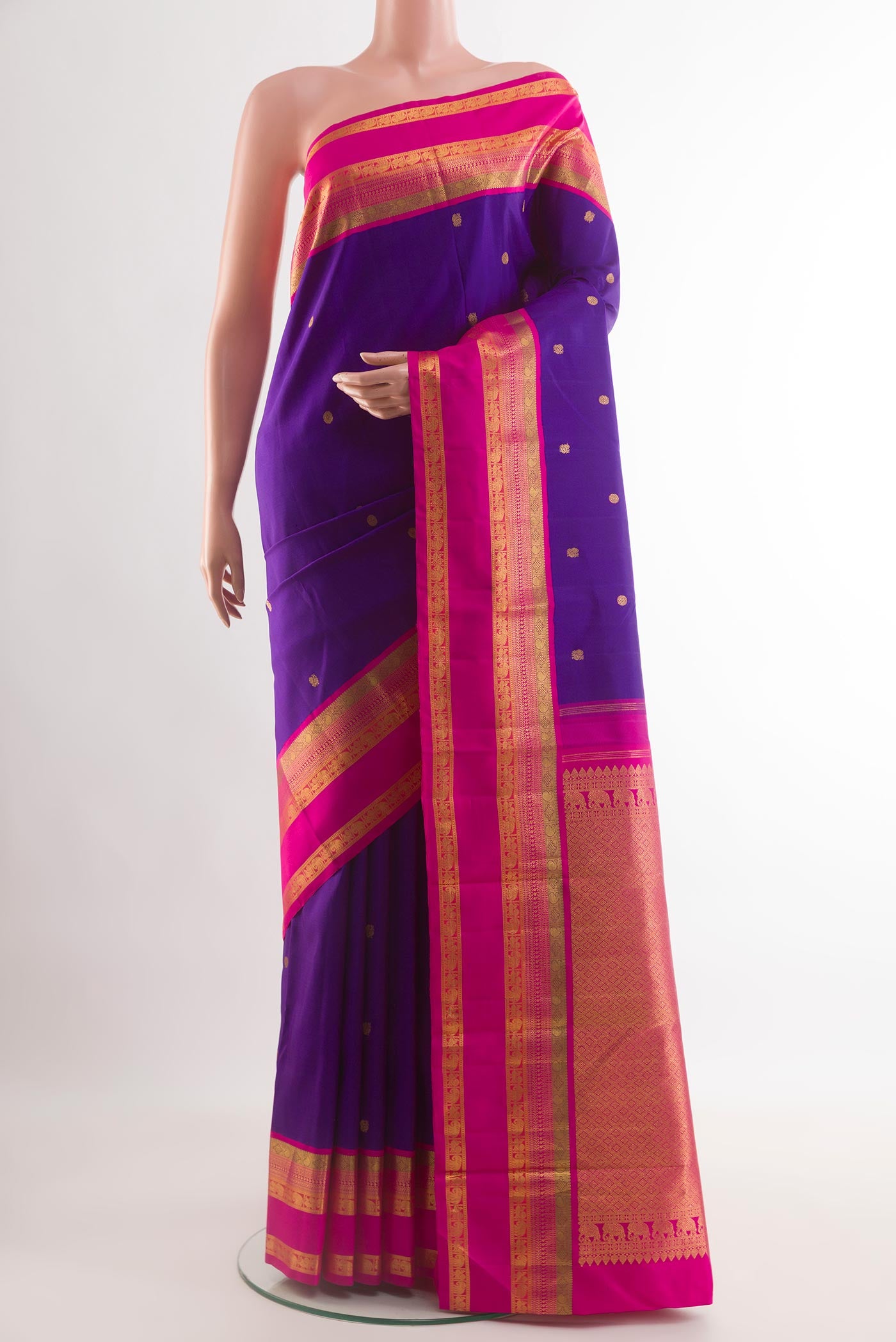 Blue Kanchipuram Silk Saree with Zari Butta on the body and Zari Border.  displayed on a mannequin