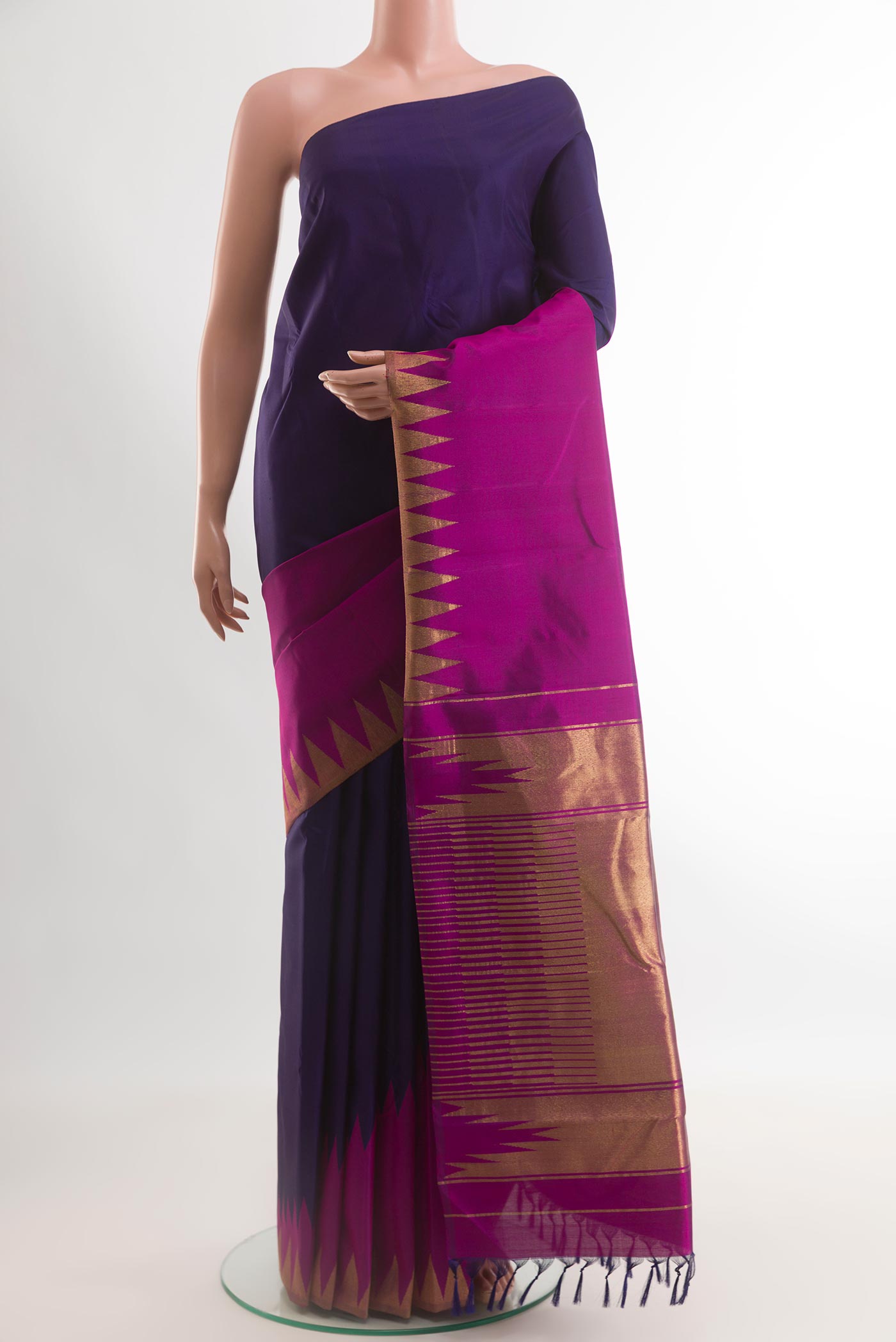 Navy Blue Kanjivaram Silk Saree with Plain Body and Rising Temple Border.  displayed on a mannequin