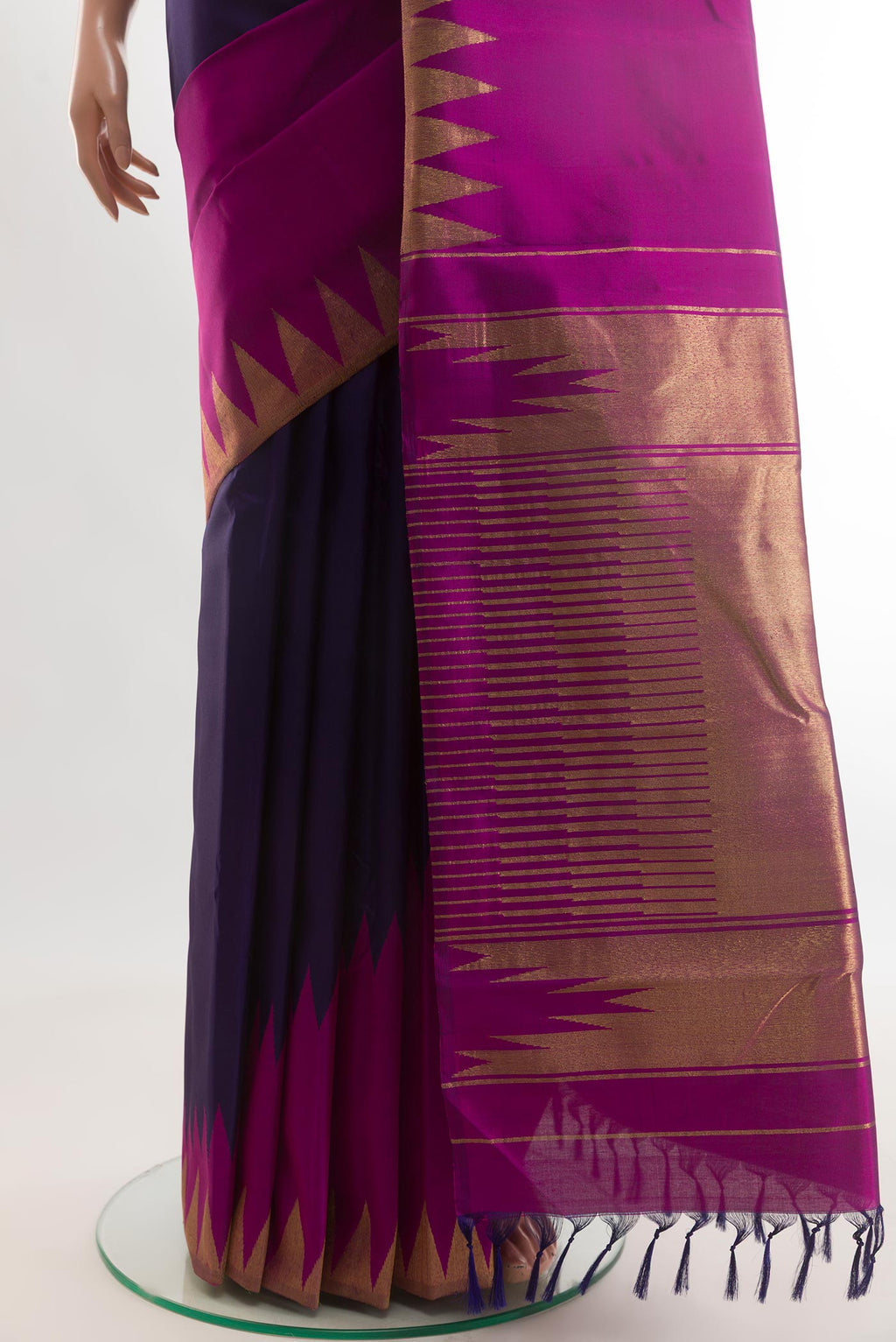 Pleats and pallu of Navy Blue Kanjivaram Silk Saree with Plain Body and Rising Temple Border. 