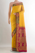 Pure Silk Yellow Kanjivaram Saree with Plain Body and Zari Border.  displayed on a mannequin
